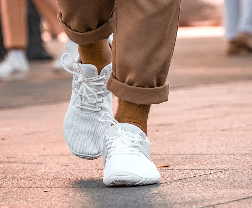 White Sneakers on Street - Saguaro Barefoot Shoes